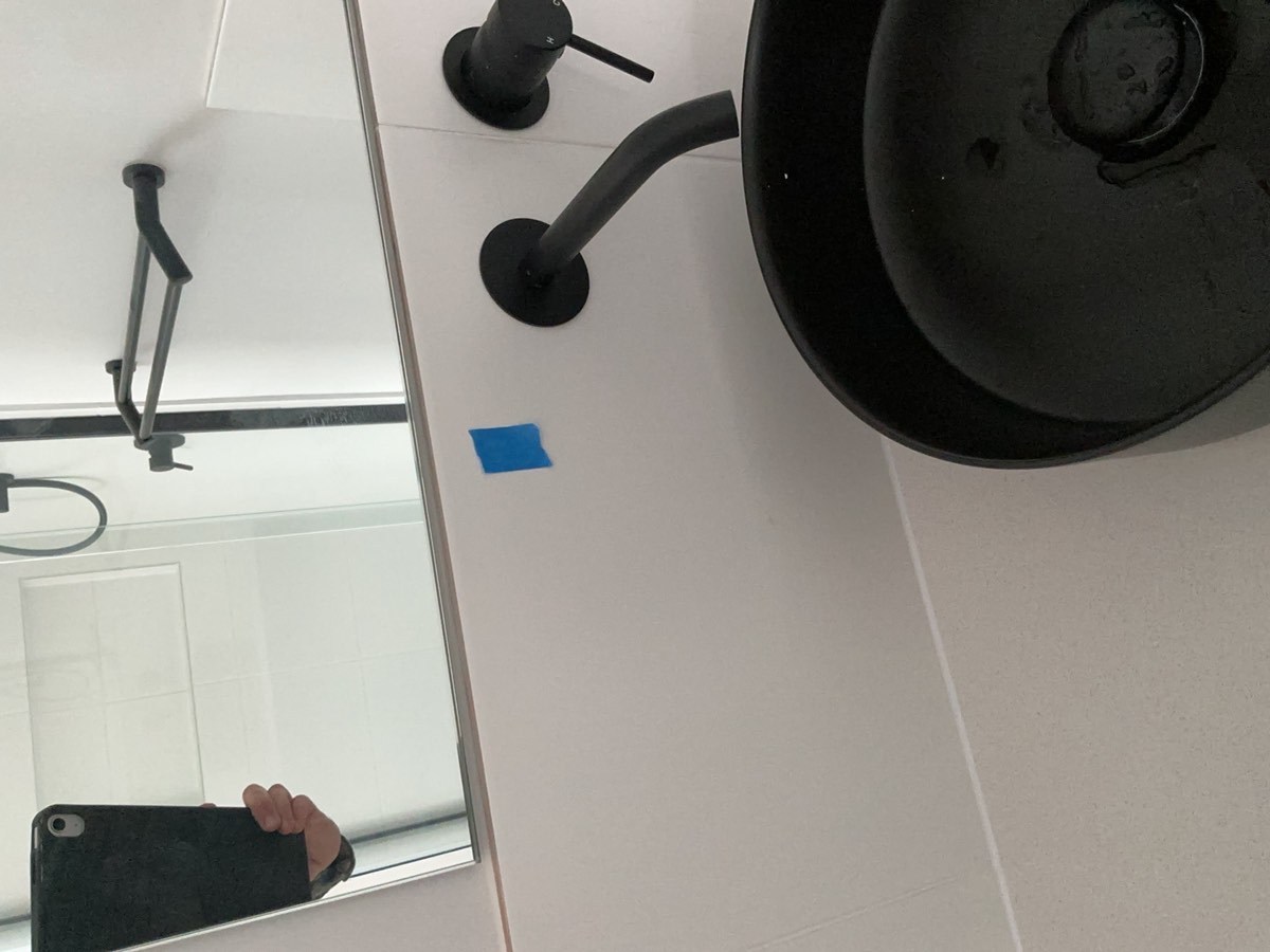 Mirror marked, recorded during a handover inspection in Oran Park